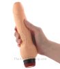 Clitterific Vibrating Dildo holding in a hand